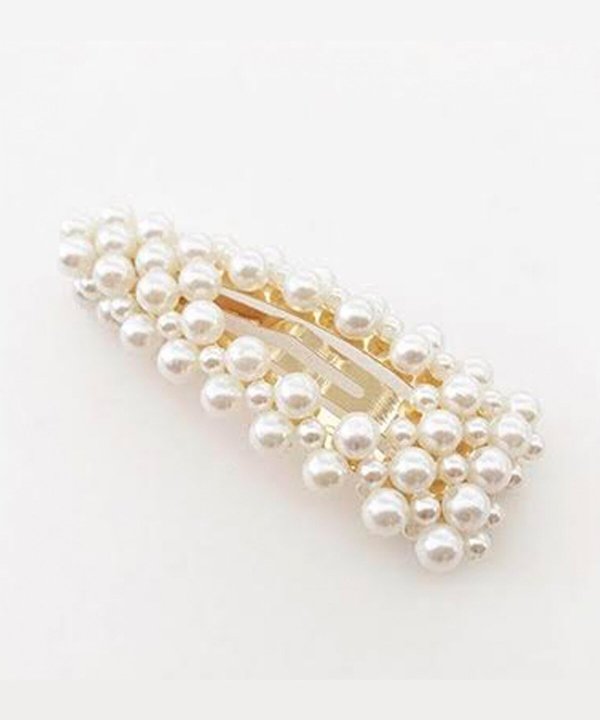 Pearl hair clip with gold accents, elegant accessory for wedding, bridal, or formal hairstyle. Handmade jewelry piece featuring a cluster of lustrous white pearls and a gold clasp.