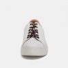 White casual sneaker with black and red laces, minimalist design, comfortable for everyday wear.