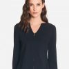 Elegant black zip-up blazer for women, featuring a tailored fit and sleek design, perfect for professional or casual wear. Made from high-quality fabric for a sophisticated look.