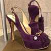 Suede burgundy high-heeled platform shoes with decorative tassels and gold accents, elegant and stylish for special occasions.