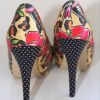 Bold floral and animal print patterned high heel shoes with polka dot soles, designed by KATYAMAKER, showcased on a white background for stylish women's footwear.