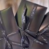 Elegant black gift boxes with satin ribbons featuring the phrase 