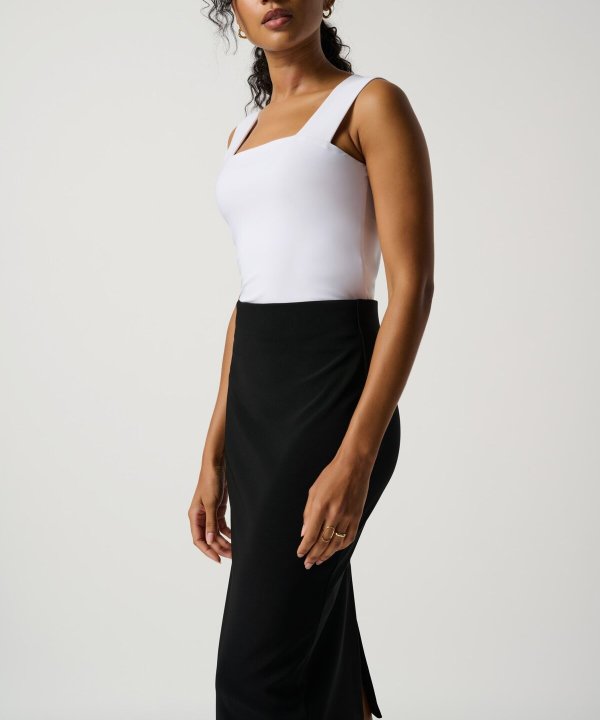 Elegant women's black and white outfit featuring a stylish fitted top with wide straps and a high-waisted black pencil skirt, perfect for fashion-forward, sophisticated looks.