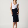 Elegant women's color-block dress with a fitted white top and navy blue midi skirt, perfect for modern fashion, sophisticated style, and versatile occasions.