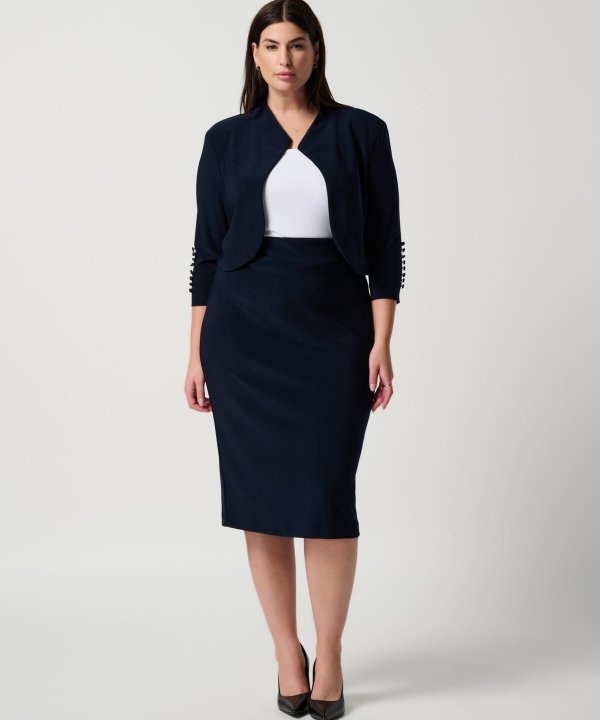 Elegant navy blue business suit featuring a tailored cropped blazer and matching pencil skirt, perfect for professional women's fashion and office attire.
