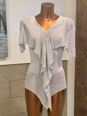 Lightweight white knit cover-up with draped ruffle design, perfect for beach or resort wear, by katyamaker.