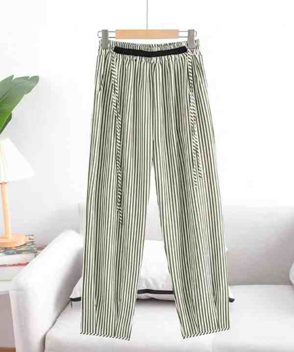 Striped high-waisted wide-leg pants with black elastic waistband, stylish and comfortable women's fashion, perfect for casual or office wear, displayed on a hanger in a modern minimalist setting.
