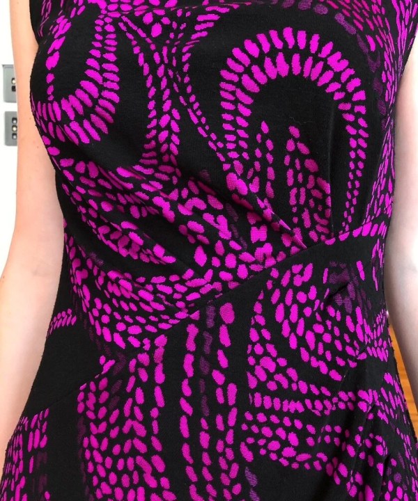 Black and pink zebra print fabric dress, fashionable, stylish, vibrant pattern, designer clothing, women's apparel, artistic design, trendy dress, statement outfit, bold print, modern fashion, unique style, high-quality fabric, casual elegance, runway ready.
