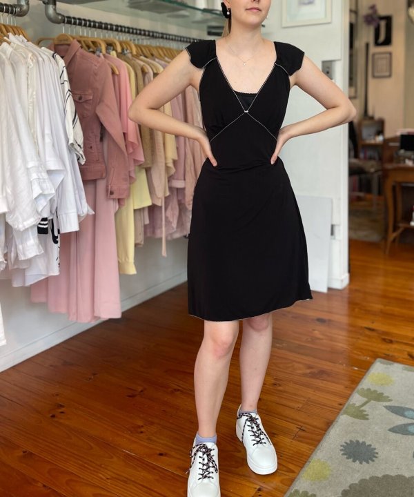 Black midi dress with cutout shoulder details, casual outfit, shopping at boutique store, stylish women's apparel, comfortable and chic dressing style.