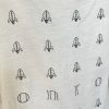Rocket pattern fabric with minimalist black line drawings of rockets for custom sewing projects and crafts.