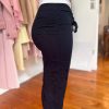 Stylish black embroidered drawstring cargo pants with slit hem detail, perfect for casual or trendy outfits.