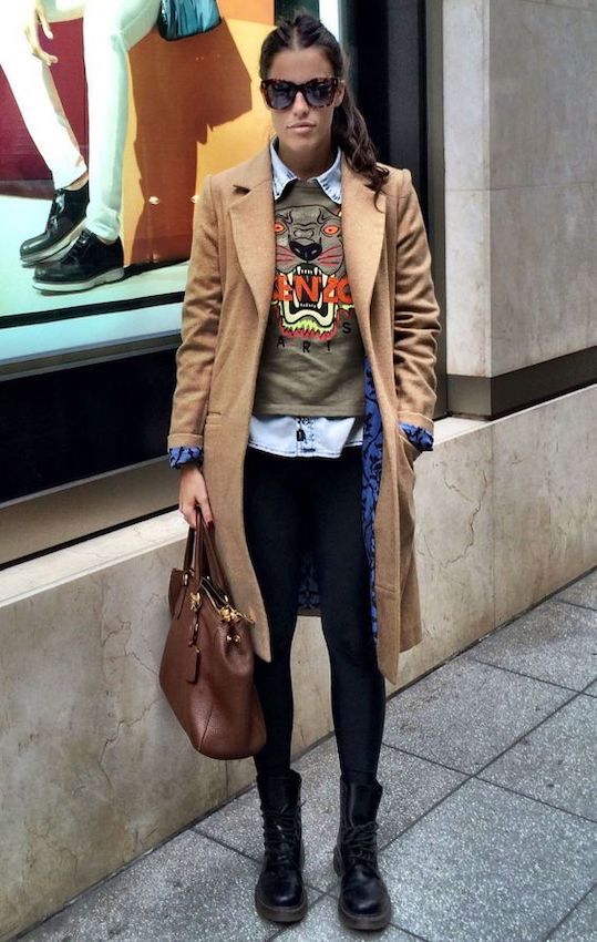 Cute street style fashion with a layered outfit, oversized sunglasses, and a brown handbag. Perfect for urban casual wear.