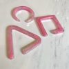 Pink marbled acrylic letter shapes spelling "PR" on a white marble surface. Modern, trendy decorative letters for home decor, embellishments, or personalized crafts. Perfect for stylish interior accents.