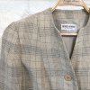 Elegant beige and brown plaid blazer, Giorgio Armani label, tailored women's fashion, classic checkered pattern, stylish professional attire for women, made in Italy, designer womenswear, sophisticated outerwear for women.