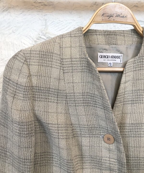 Elegant beige and brown plaid blazer, Giorgio Armani label, tailored women's fashion, classic checkered pattern, stylish professional attire for women, made in Italy, designer womenswear, sophisticated outerwear for women.