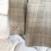 Classic beige textured blazer with a single button closure, perfect for a professional or casual look, featuring a subtle houndstooth pattern and a tailored fit for everyday style.