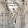Elegant beige woven blazer by Giorgio Armani, tailored for a sophisticated look, featuring high-quality craftsmanship and classic style, perfect for formal or professional settings.