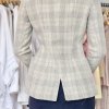 Falls, beige plaid tailored blazer on mannequin, stylish women's business jacket, classic checkered design, versatile fall fashion, women’s office wear, kateyamak fashion, sophisticated blazer for women.