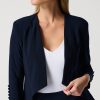 Elegant navy blue tailored blazer for women, perfect for office wear or formal occasions. Made from high-quality fabric, features sleeve buttons, and a polished fit.