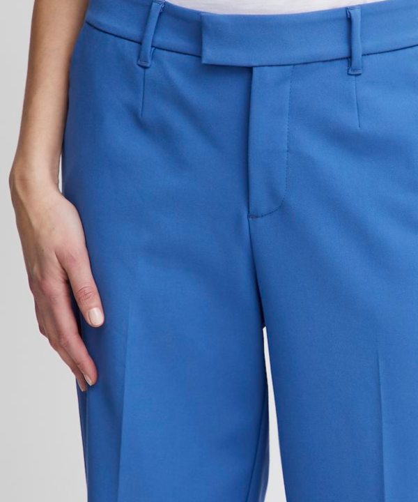Bright blue tailored high-waisted pants for women, perfect for professional or casual wear, with a sleek fit and belt loops.