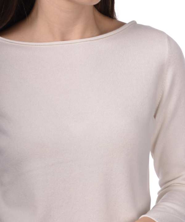 Soft cream long sleeve top, minimal fashion, casual women's clothing, elegant knitwear, versatile everyday outfit.