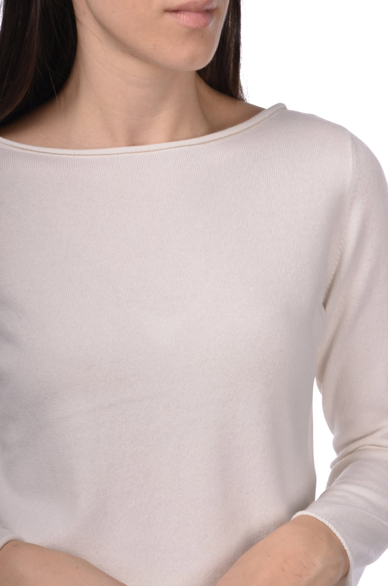 Soft cream long sleeve top, minimal fashion, casual women's clothing, elegant knitwear, versatile everyday outfit.