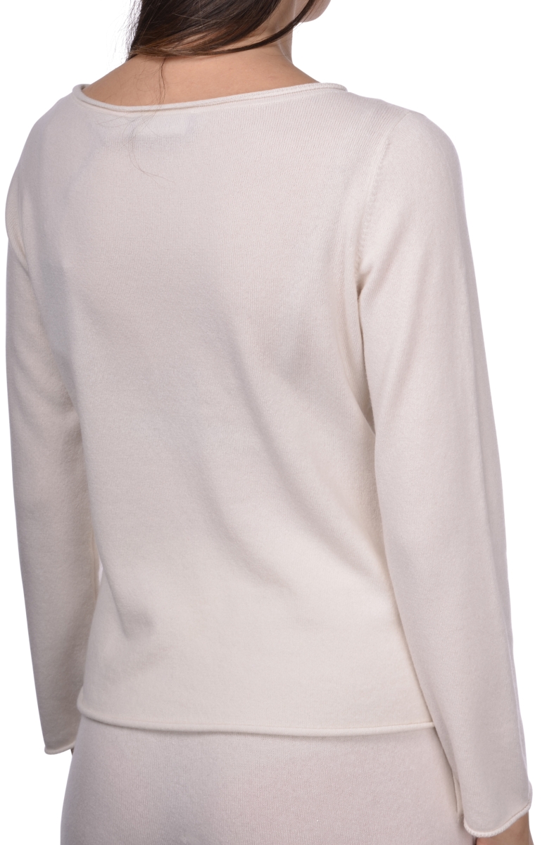 Soft cream-colored knit long-sleeve sweater, versatile and comfortable for casual wear, featuring a classic round neckline, perfect for layering or wearing alone for a cozy everyday look.