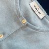 Elegant light grey cashmere cardigan by Grand Sasso, Italian craftsmanship, featuring soft texture, classic round neckline, and pearl buttons for a timeless sophisticated look.