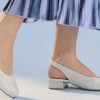 Stylish beige slingback heels with low block heel, perfect for spring or summer. Made of textured fabric, comfortable and elegant for casual or formal wear.