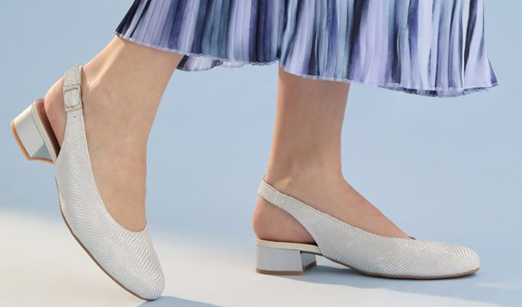 Stylish beige slingback heels with low block heel, perfect for spring or summer. Made of textured fabric, comfortable and elegant for casual or formal wear.