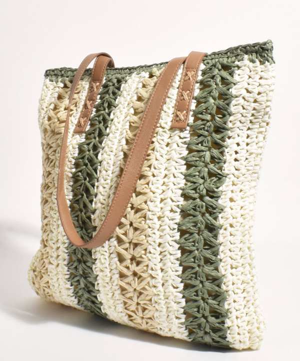 Handcrafted woven straw tote bag with tan leather handles, perfect for summer and beach accessories, featuring stylish striped design and eco-friendly materials from katyamaker.com.