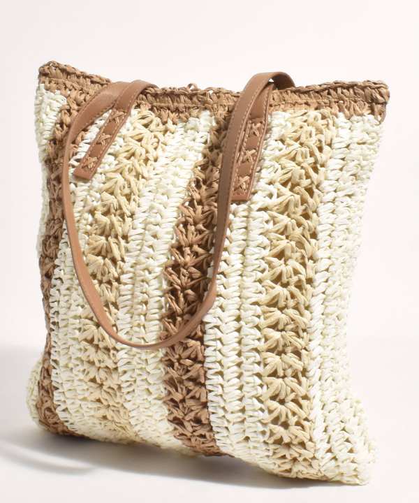 Handwoven straw tote bag with leather straps, perfect for summer beach outings, casual shopping, or everyday use, showcasing artisanal craftsmanship and boho-chic style.