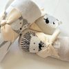 Soft knitted baby blankets with animal and cartoon face designs, wrapped with creamy bow ties, perfect for nursery decor and baby gift sets.