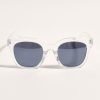 Sunglasses with transparent frame and dark lenses, stylish accessories for fashion and UV protection.