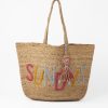 Colorful beach tote bag with embroidered "SUNNY DAYS" lettering and tassel charm, perfect for summer outings and seaside adventures.