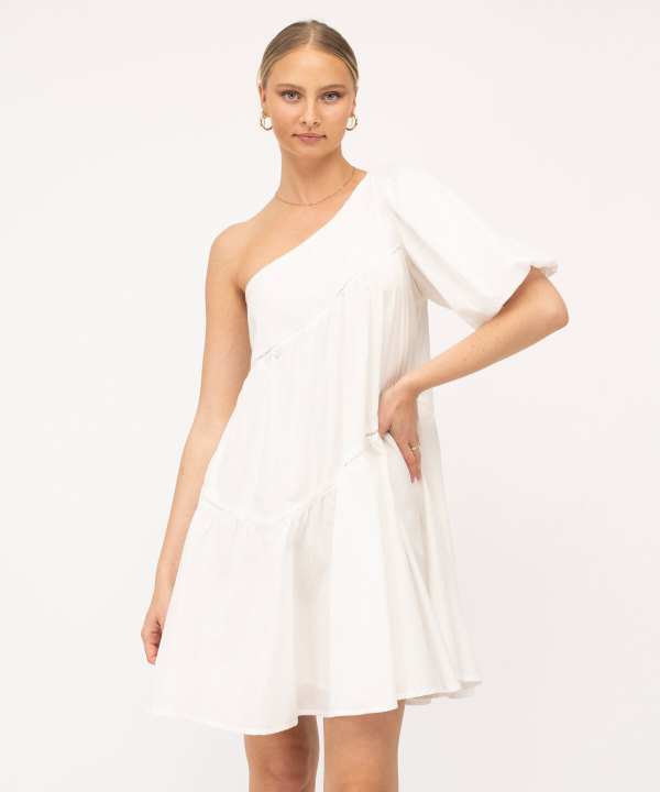 Linen one-shoulder dress with puff sleeve and flowing skirt, perfect for summer fashion and casual chic styles. Elegant and breezy women’s clothing by Katya Maker.