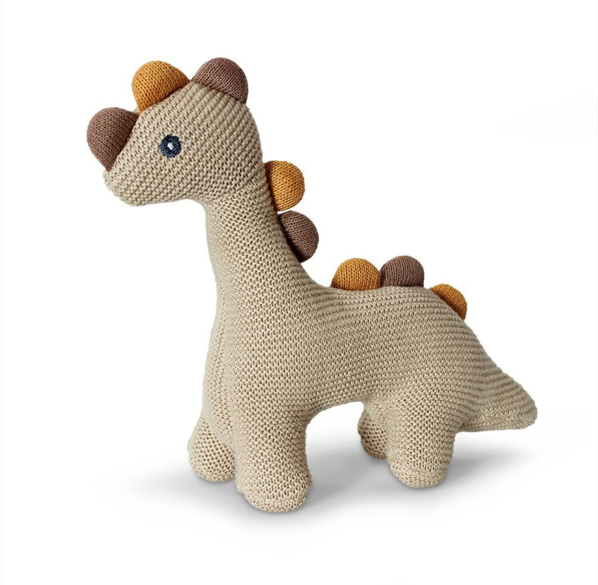 Handmade crochet dinosaur plush toy for children, soft beige with colorful spikes, perfect for nurseries and playrooms, eco-friendly and washable.