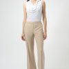 Elegant white sleeveless blouse with draped neckline, paired with beige wide-leg tailored pants—perfect for sophisticated office wear or chic casual outfits.