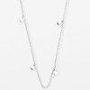 Delicate silver layered necklace with small clover-shaped charms, perfect for minimalist jewelry lovers, made by Katyamaker, a renowned designer for handcrafted, stylish accessories.