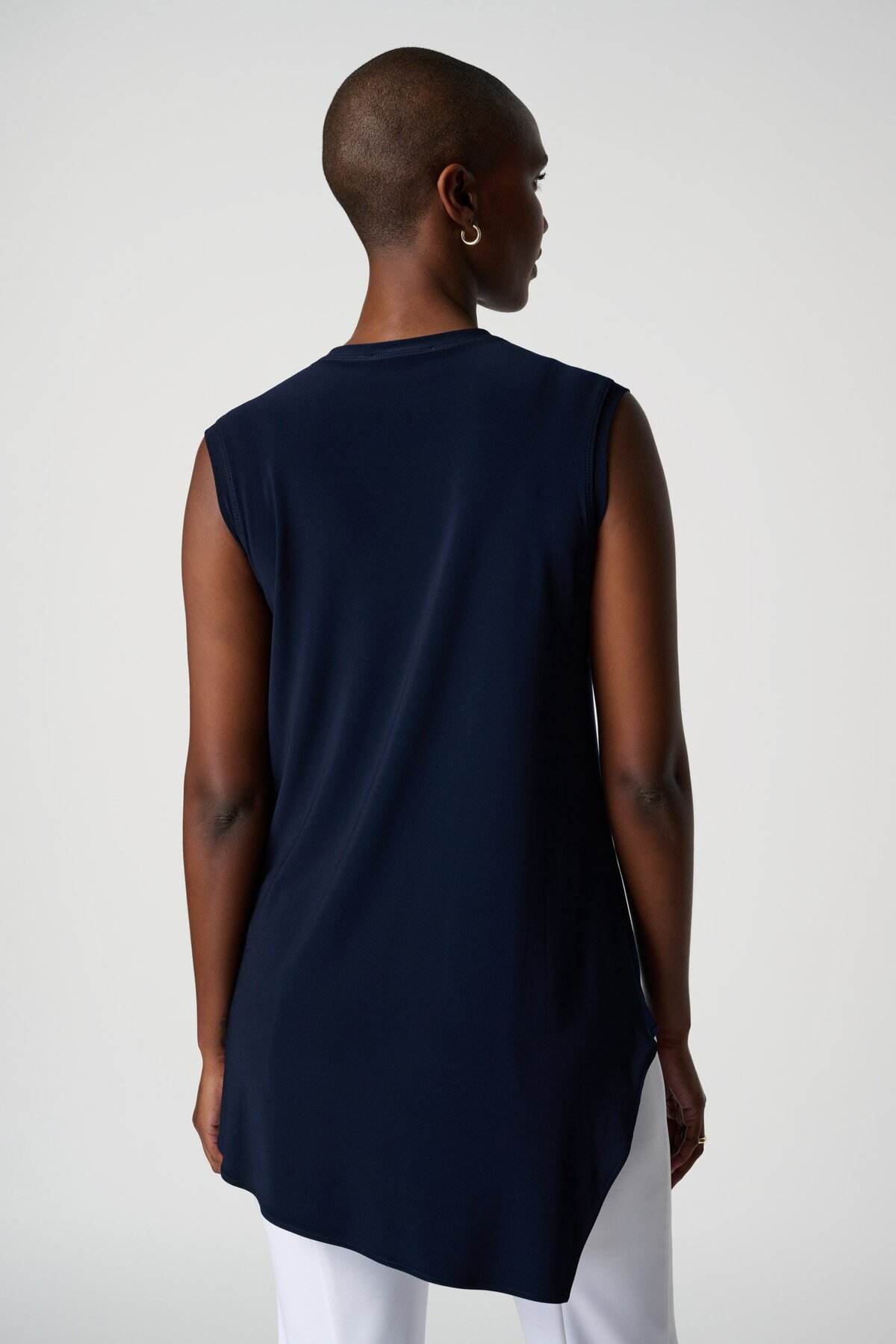Flowy navy sleeveless top for women, featuring a modern minimalist design and high-quality fabric perfect for casual or professional wear.