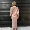 Luxury minimalistic outfit women’s fashion taupe knit sweater and matching long skirt casual elegant modern style.