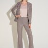 Shimmering metallic pantsuit with blazer and wide-leg trousers, stylishly paired with a beige silk top, perfect for fashion-forward events and sophisticated professional looks.
