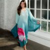 Vibrant turquoise floral maxi dress with pink and white flower print, flowing chiffon fabric, perfect for summer events and garden parties, styled by Katy A Maker.