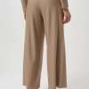 Beige wide-leg glitter trousers, stylish women's fashion, comfortable high-waist pants, casual elegant look, modern loungewear, versatile outfit staple.