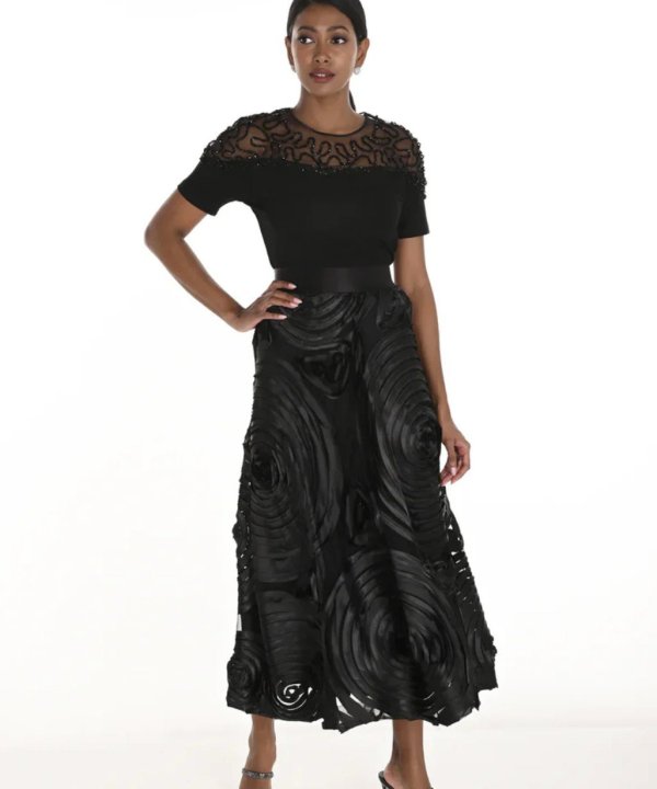 Elegant black designer outfit featuring intricate lace detailing and statement fabric textures for women’s fashion and evening wear.